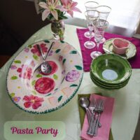 may dinner table in pinks and greens for a pasta party